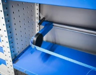 02_Détail du double système d’arrimage avec navette à haute résistance, levier de blocage et sangle